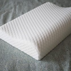 Orthopedic pillow on a bed ,
